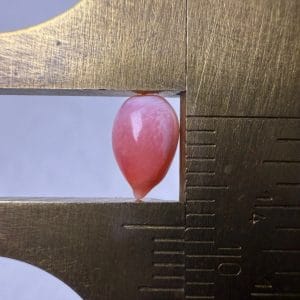 1.1ct Natural Queen Conch Pearl with flame, tear shape and pink color, cracked.