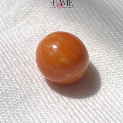 10 - 5.4ct Orange Natural Conch Pearl With Perfect Round Shape.jpg
