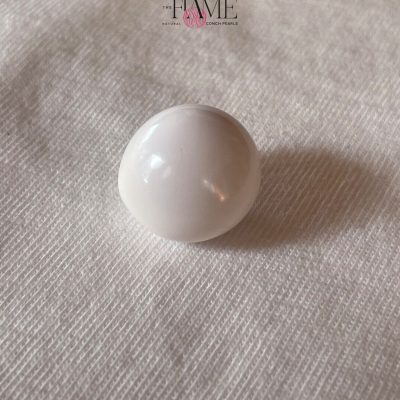 11- 29.1ct Natural Conch Pearl, white color and round shape with cracked