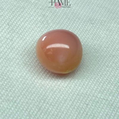 12- 8.0 ct Natural Conch Pearl, pink and yellow spotted color, round shape