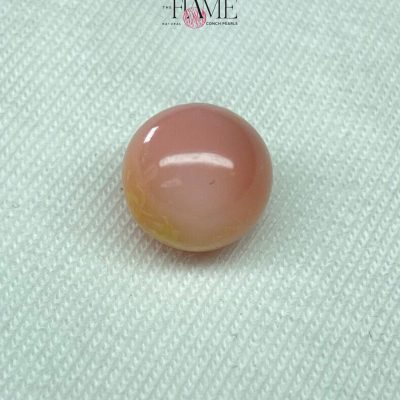 7- 8.0 ct Natural Conch Pearl, pink and yellow spotted color, round shape